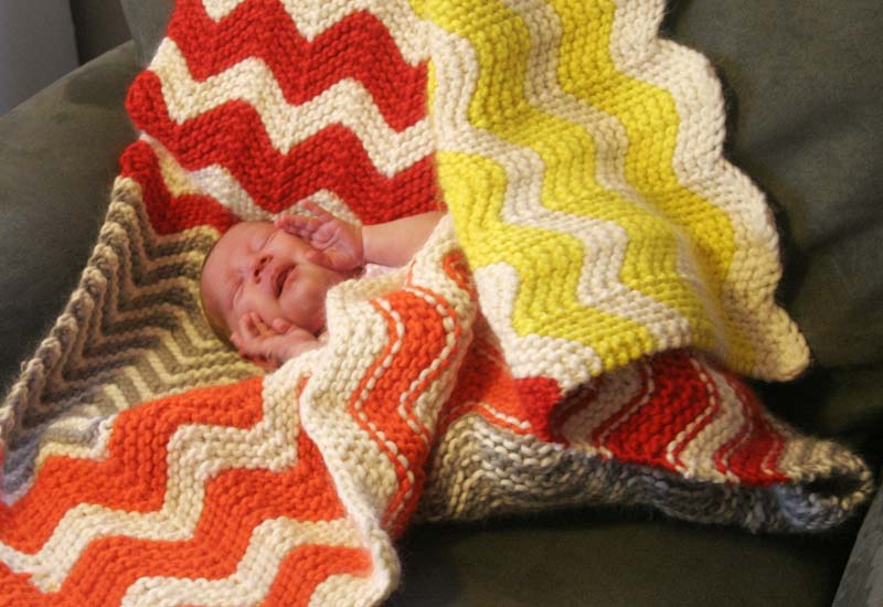 baby nugget in knitted blanket